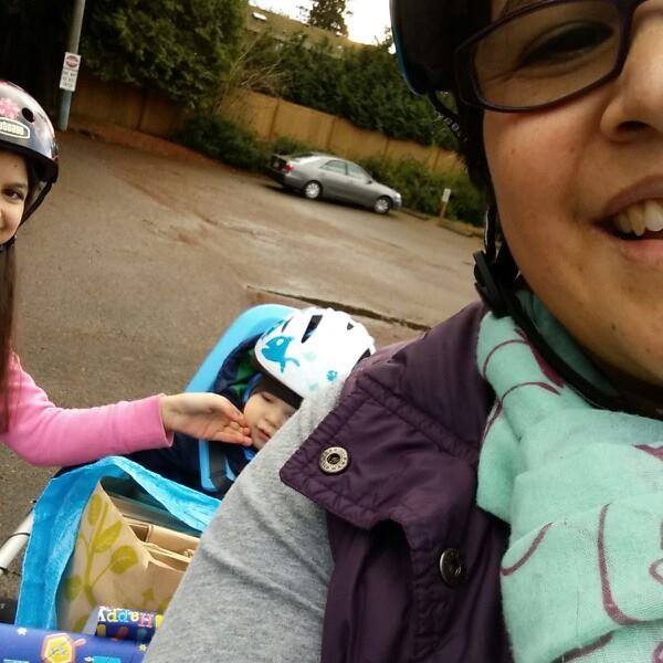 Shirley Savel biking with the kids.