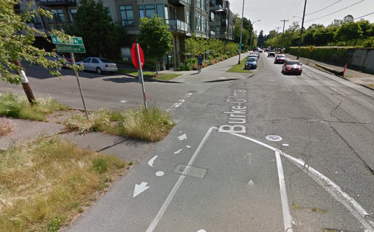 The curb forces an awkward swerve to stay on the trail. The ride would be much more comfortable with a much wider curb cut or even better a table top intersection.