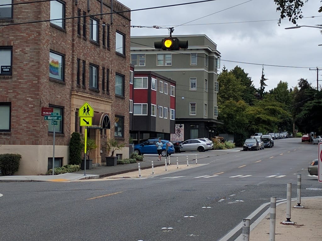 Curb extension using paint and flexible posts at 12th Ave E and E Mercer St. (Owen Pickford)