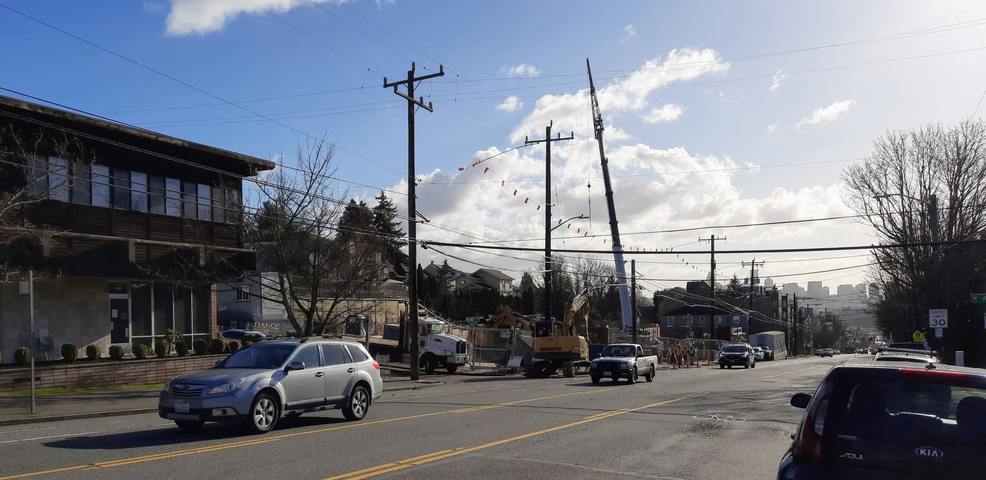 
                     The view of the downtown skyline looking down Stone Way with a construction site.
                     