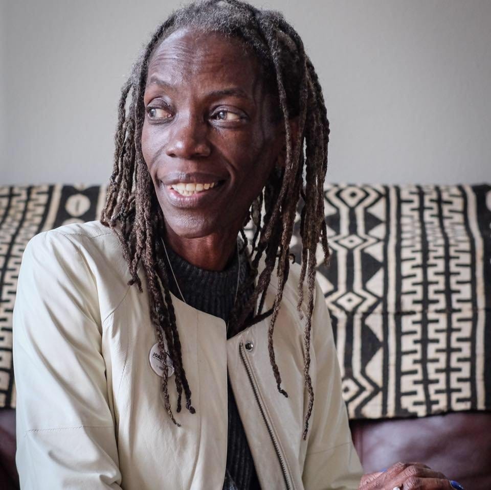 JoAnn Hardesty is a black woman with tight dreadlocks.