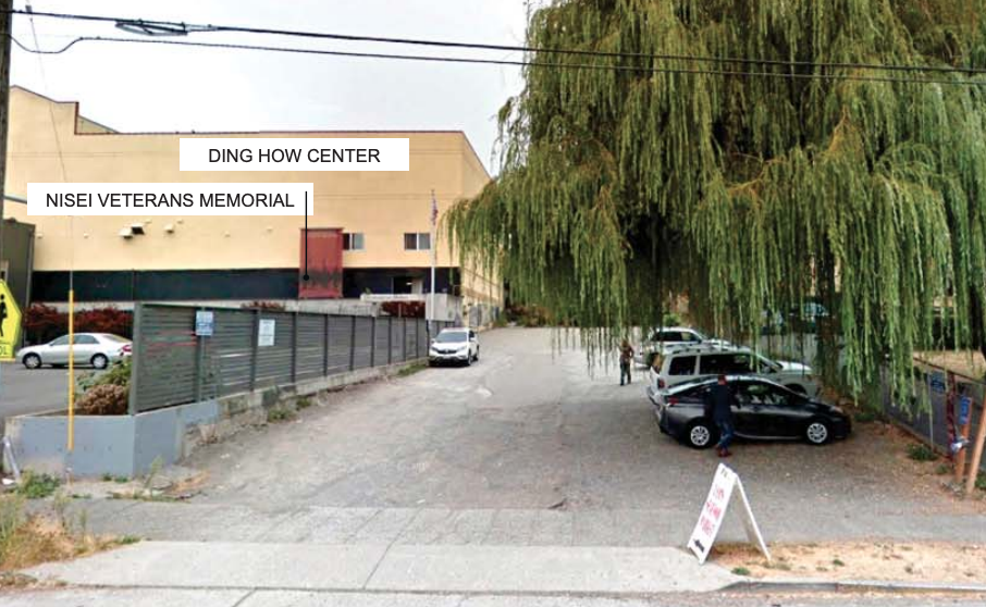 A photograph of the site of the planned park in Little Saigon. The area is currently used as a parking lot and has large willow trees that will be preserved. Adjacent to the park are the Ding How Center and Nisei Veterans Memorial.