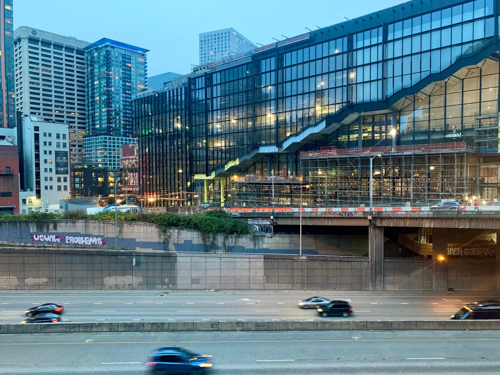A photo shows the almost complete new Washington State Convention center adjacent to I-5 in Downtown Seattle. 