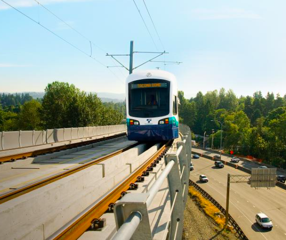A rendering of an elevated Tacoma dome light rail train above Interstate 5.