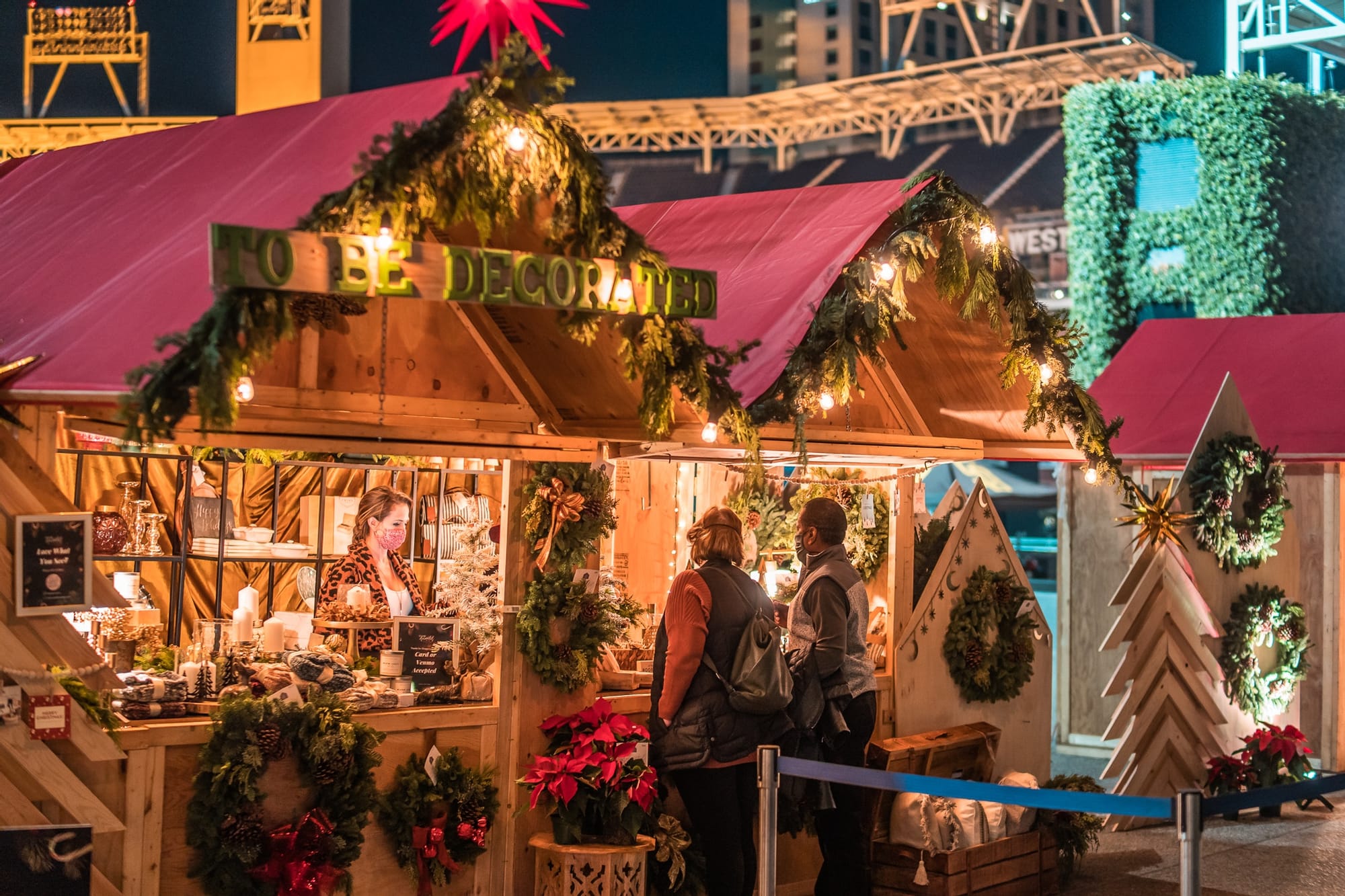A highly decorated wooden kiosk with garland.